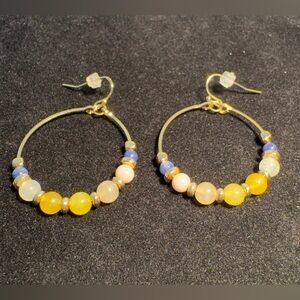 Loft gold-tone hoop earrings decorated with multi-color beads.